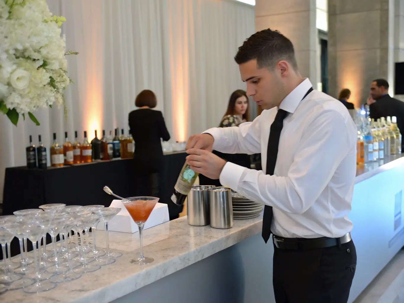A vibrant image depicting a team of bartenders expertly serving drinks at a high-end corporate event, showcasing Cadre's event staffing capabilities.